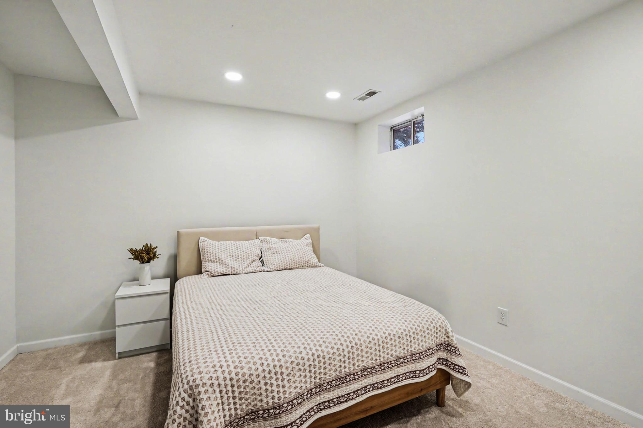 19201 Buna Street Triangle, VA 22172 - Photo 51 of 69 Cozy, serene bedroom with natural light.
