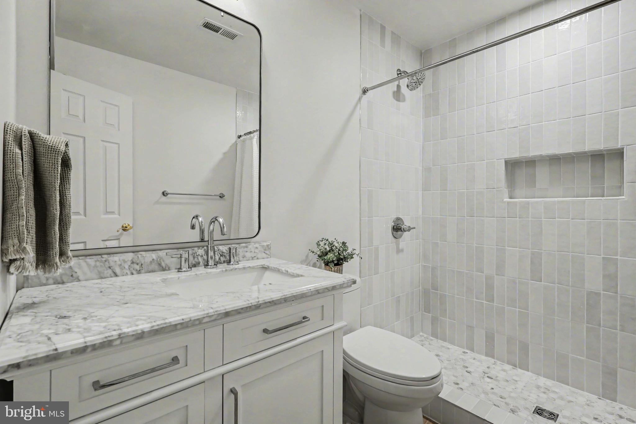 19201 Buna Street Triangle, VA 22172 - Photo 53 of 69 Elegant bathroom with modern finishes.
