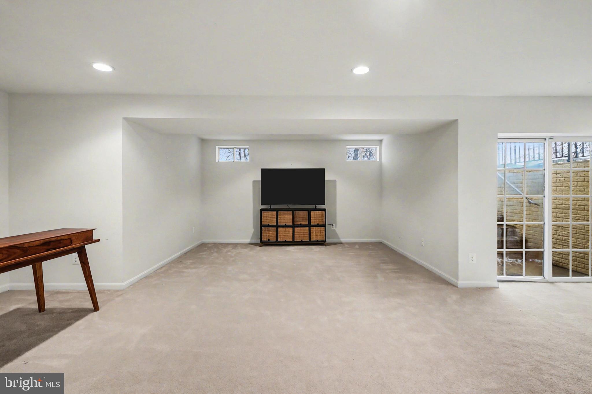 19201 Buna Street Triangle, VA 22172 - Photo 58 of 69 Spacious, light-filled basement retreat.