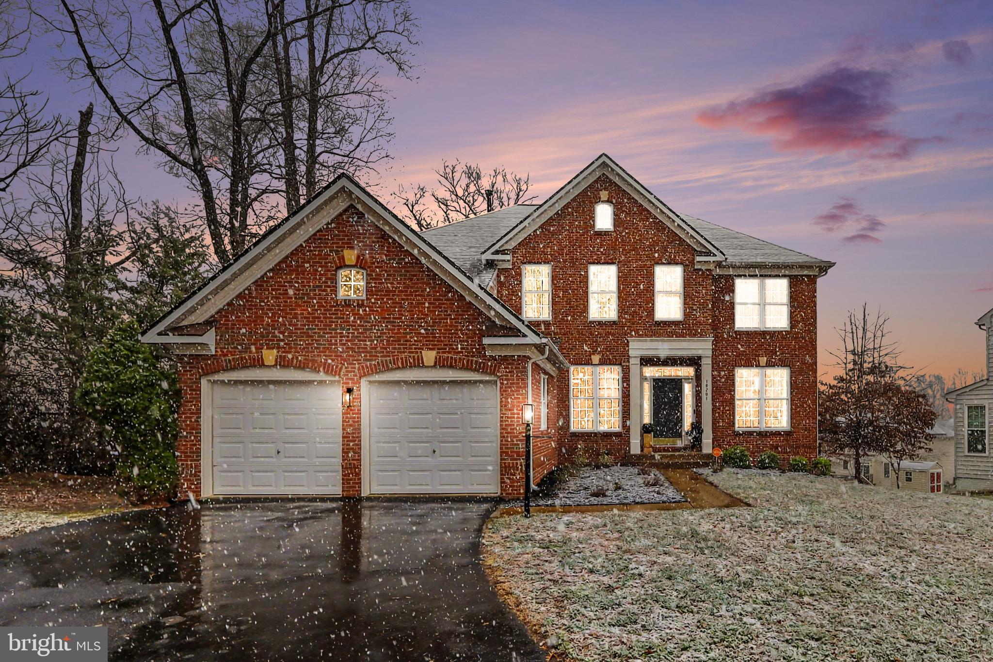 19201 Buna Street Triangle, VA 22172 - Photo 6 of 69 Charming brick home under a snowy sunset.