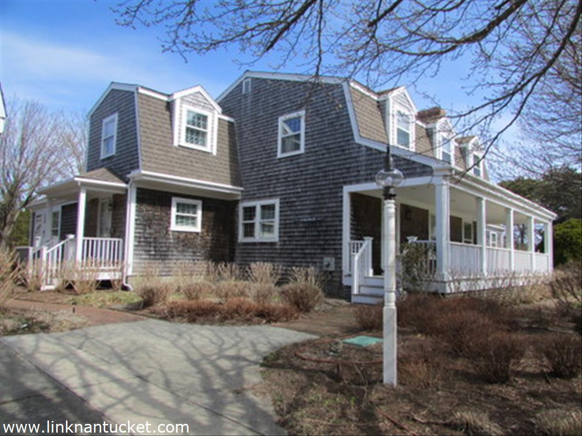 73 Fairgrounds Road Nantucket, MA 02554 - Photo 1 of 15 a front view of a house with a yard