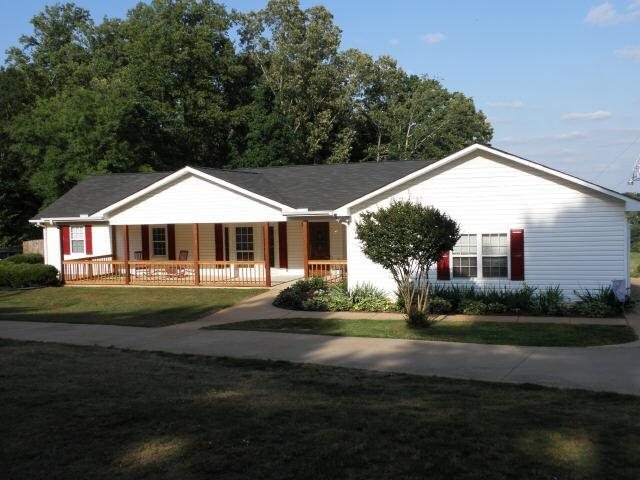 845 Moon Bridge Road, Unit 1 Winder, GA 30680 - Photo 1 of 1 a front view of a house with a yard