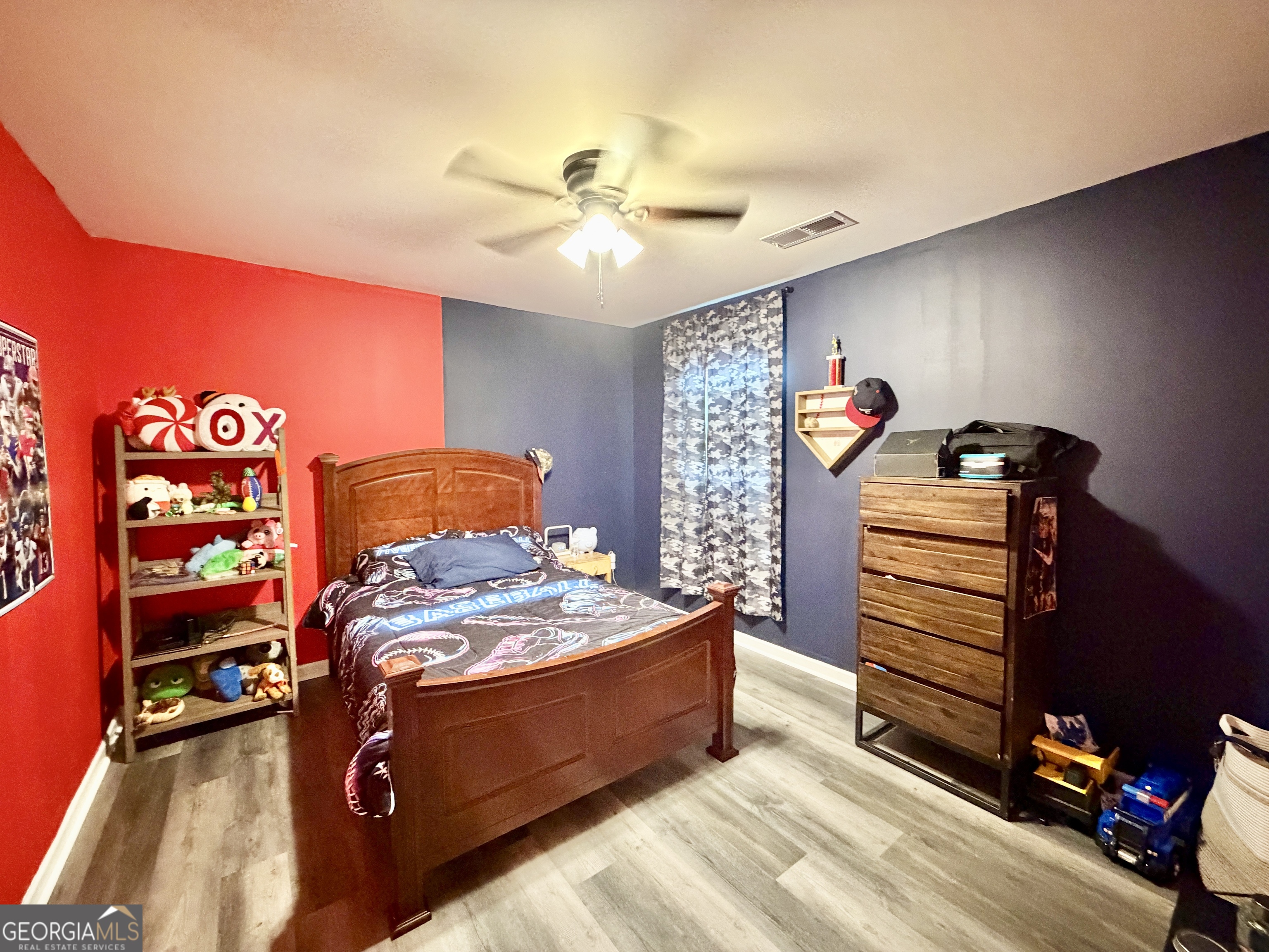 219 Barnyard Way Perry, GA 31069 - Photo 33 of 44 a bed room with a bed and a ceiling fan