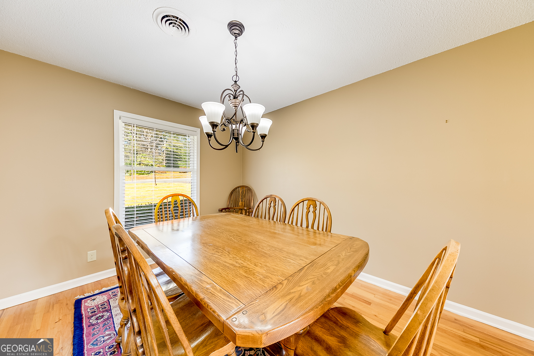 1174 Hospital Road Commerce, GA 30529 - Photo 11 of 40 a dining room with furniture and chandelier