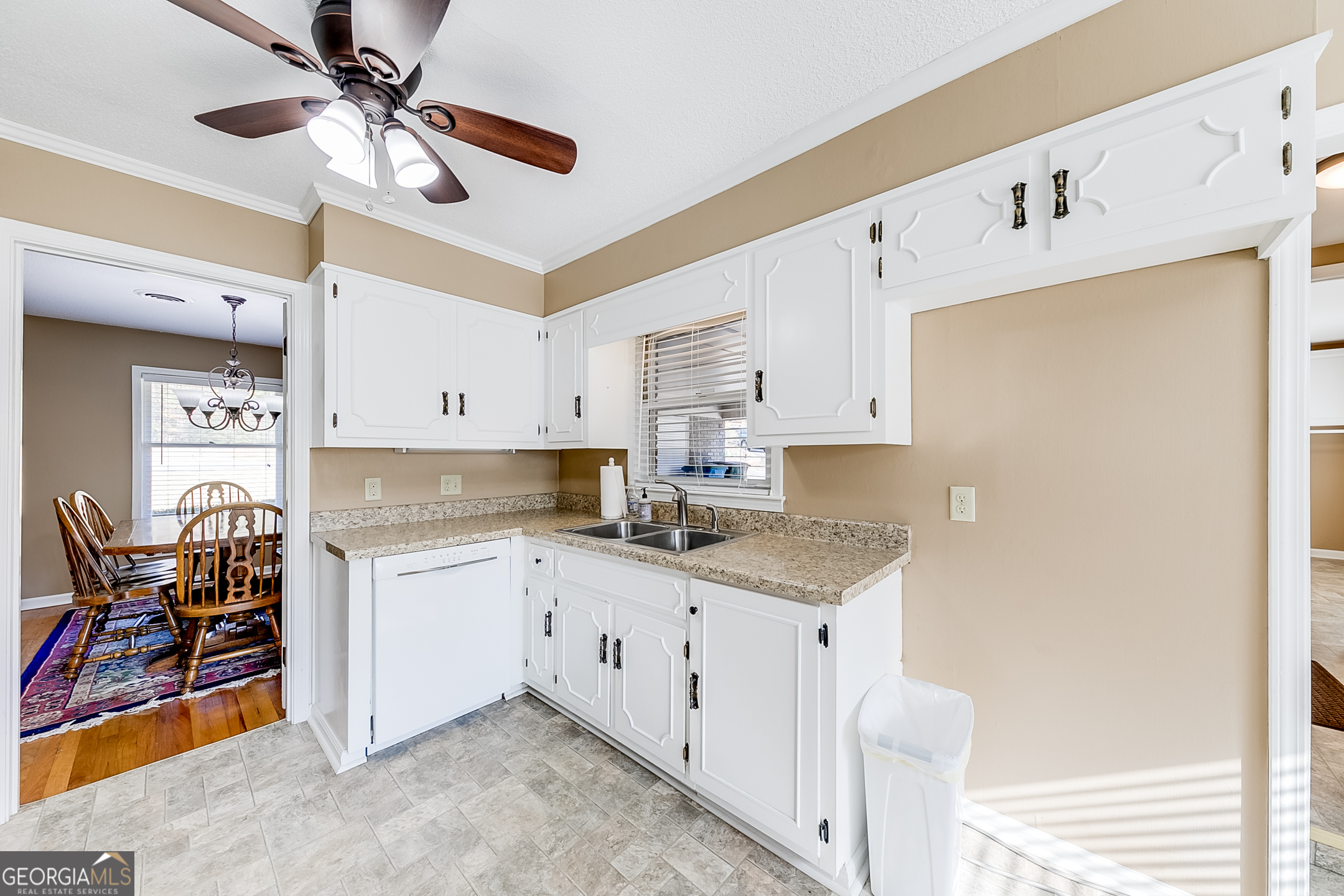 1174 Hospital Road Commerce, GA 30529 - Photo 13 of 40 a kitchen with stainless steel appliances a stove a sink cabinets and a window