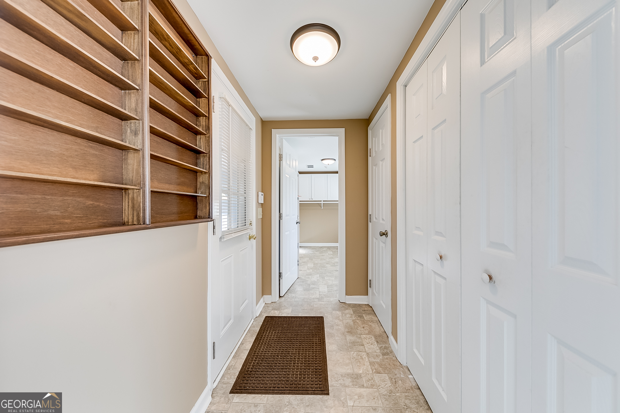 1174 Hospital Road Commerce, GA 30529 - Photo 15 of 40 a view of a hallway with wooden floor and a window