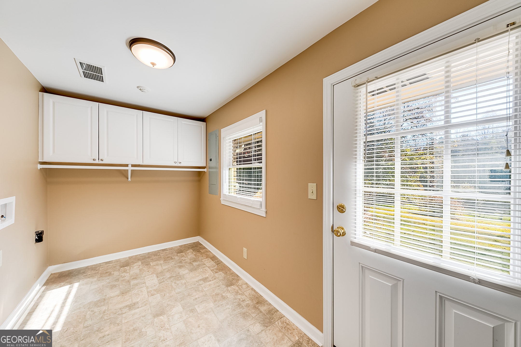 1174 Hospital Road Commerce, GA 30529 - Photo 16 of 40 a view of a kitchen with wooden floor and a window