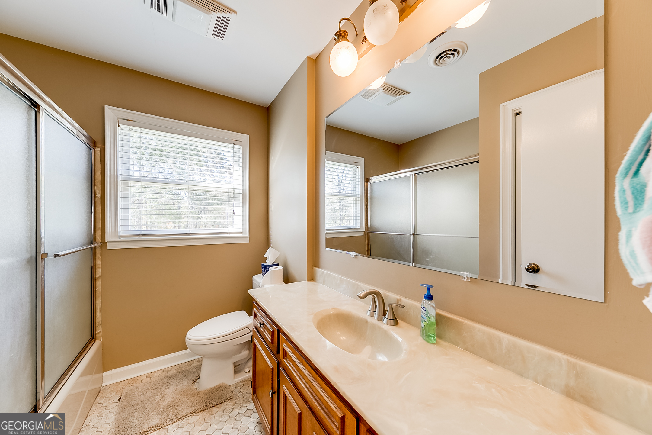 1174 Hospital Road Commerce, GA 30529 - Photo 21 of 40 a bathroom with a sink a toilet and a mirror