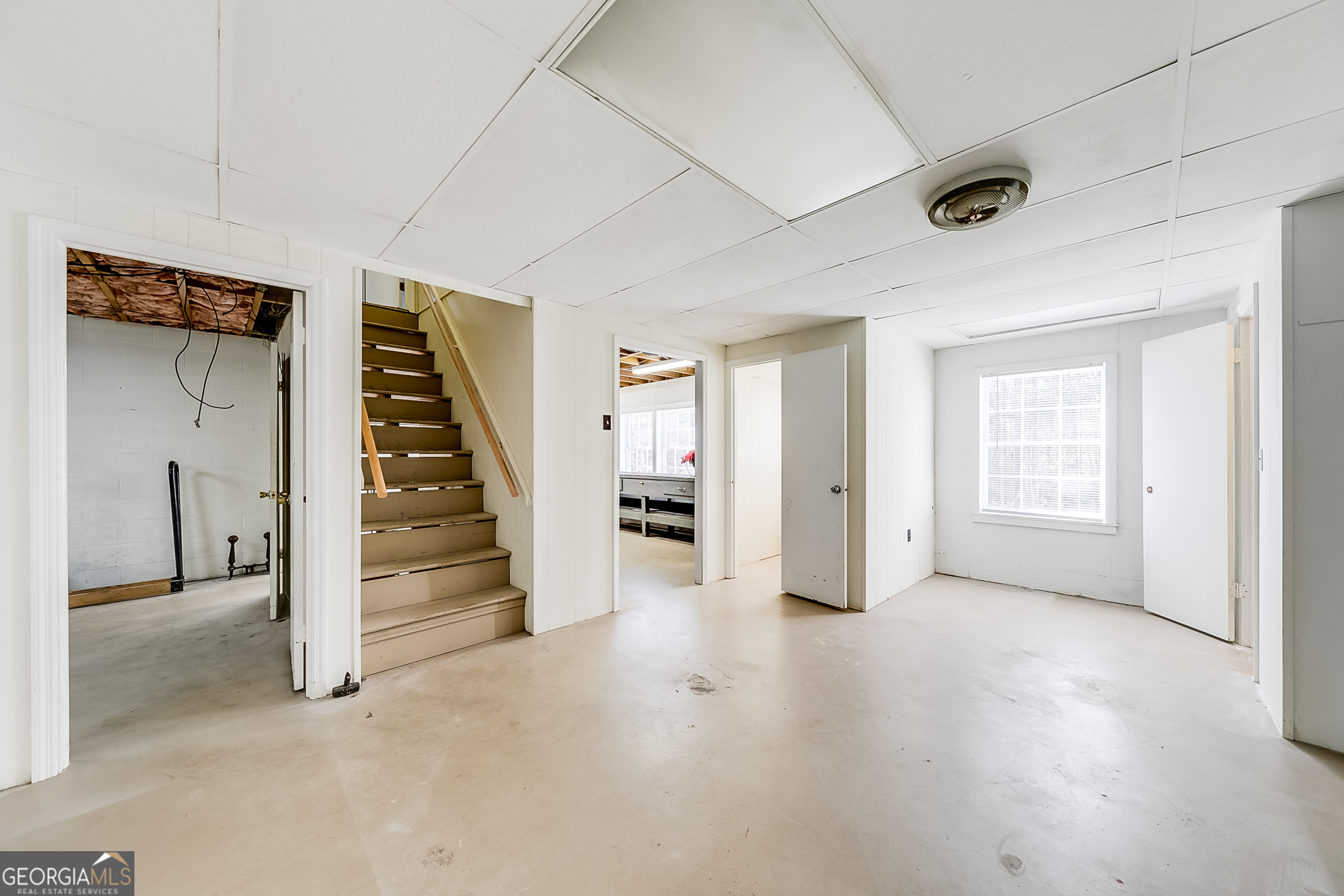 1174 Hospital Road Commerce, GA 30529 - Photo 23 of 40 a view of an empty room with a fireplace and a window