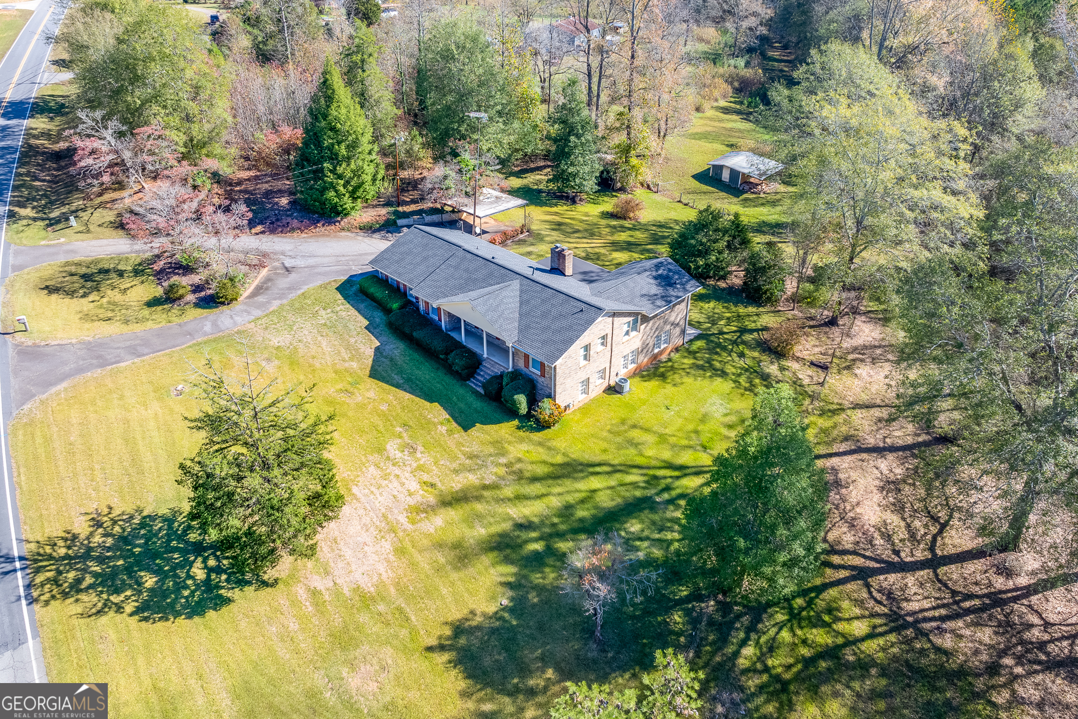 1174 Hospital Road Commerce, GA 30529 - Photo 3 of 40 a view of swimming pool from a garden