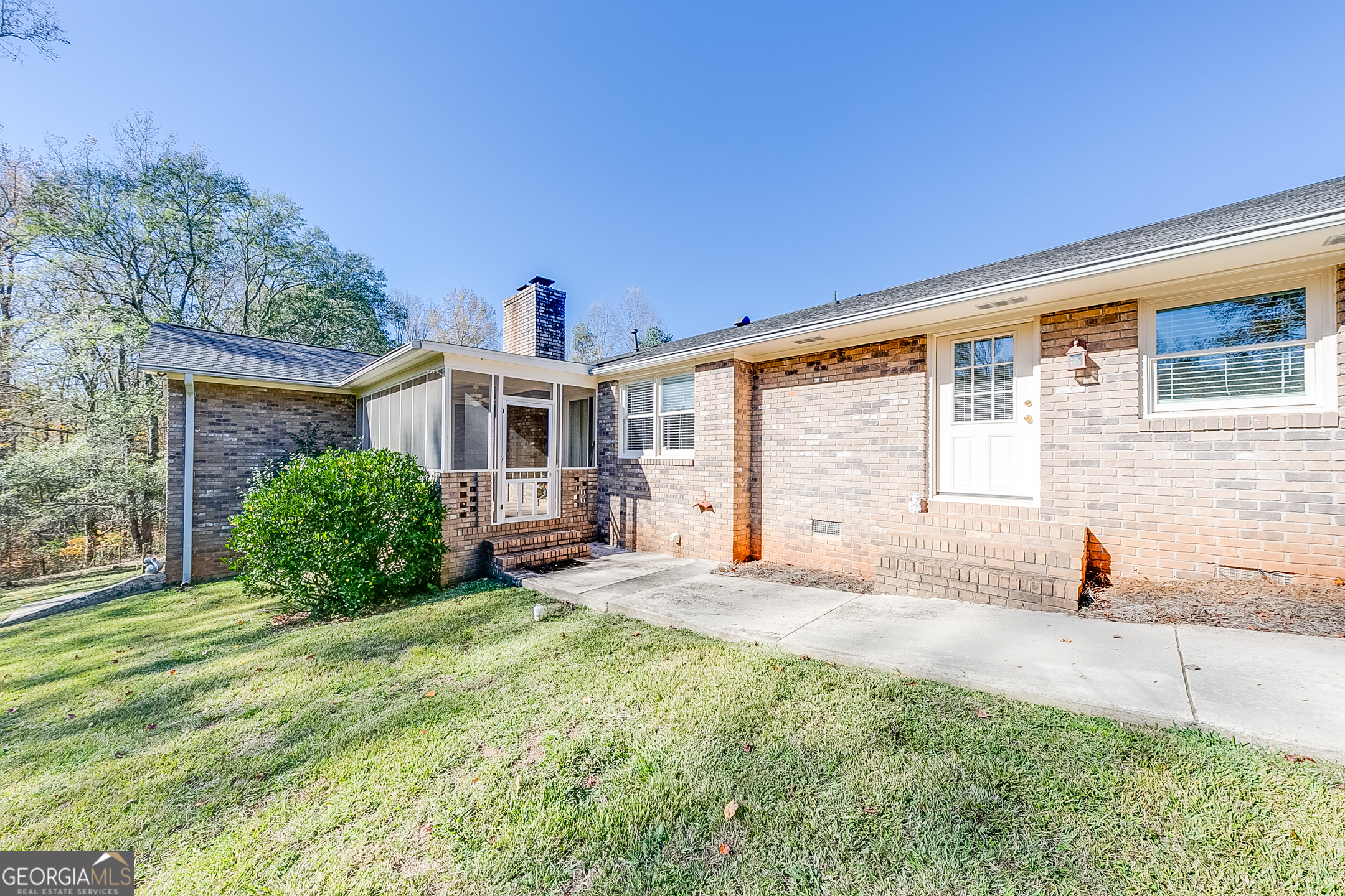 1174 Hospital Road Commerce, GA 30529 - Photo 32 of 40 a view of a house with backyard and sitting area