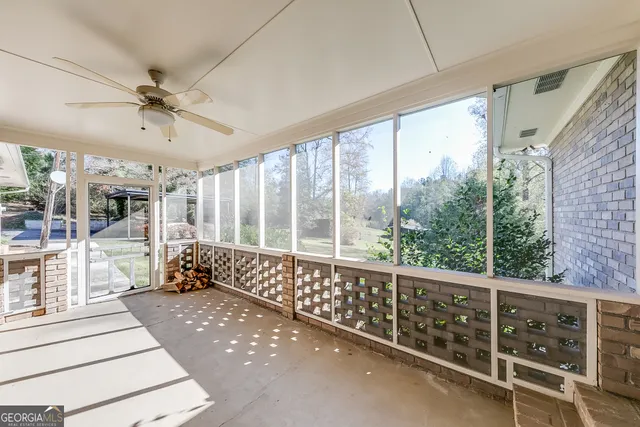 a view of a porch with wooden floor and outdoor space