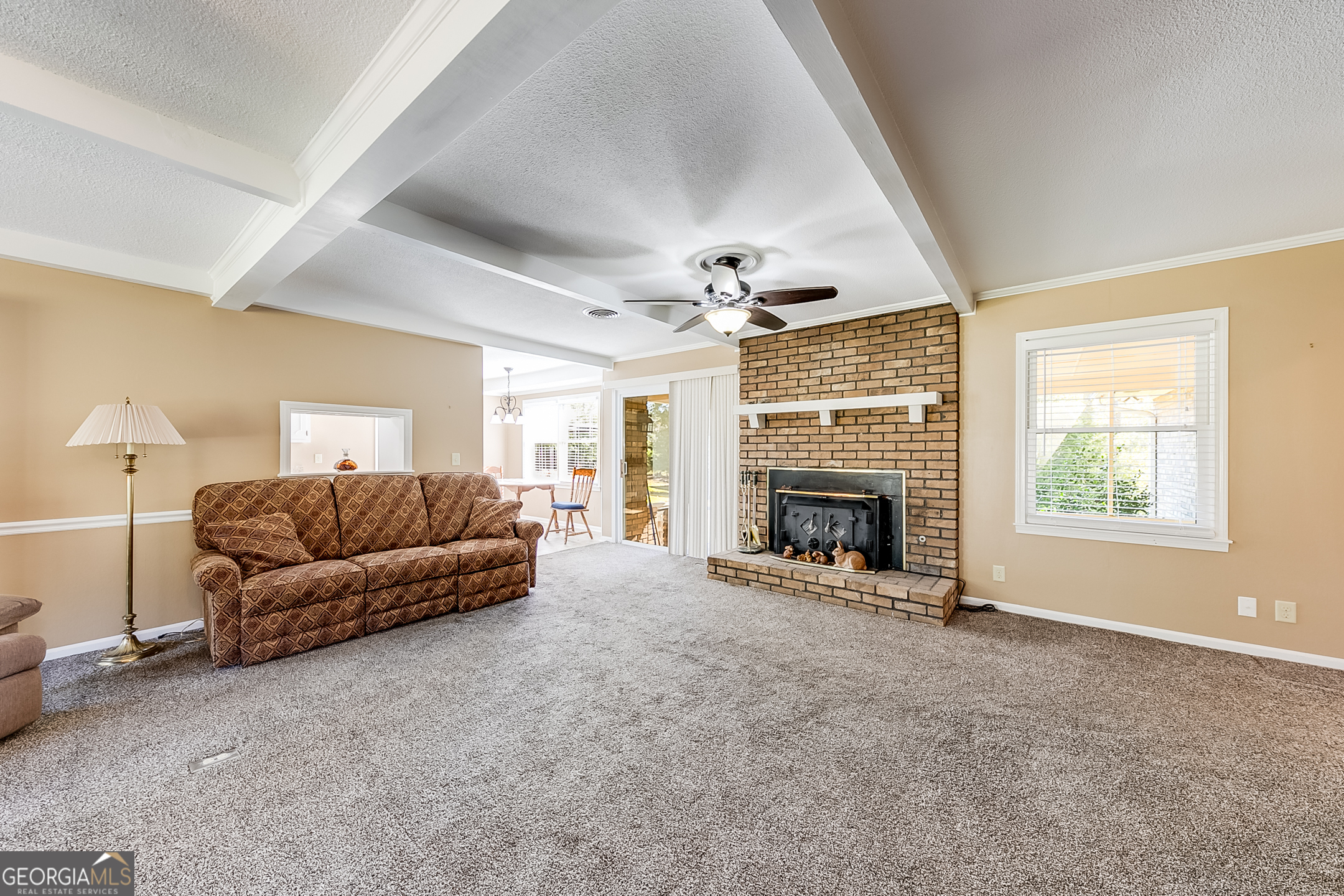 1174 Hospital Road Commerce, GA 30529 - Photo 7 of 40 a living room with furniture and a fireplace