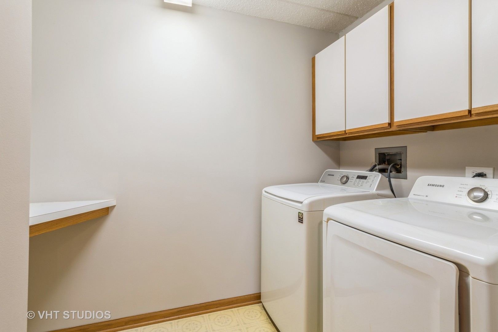 7450 North Waukegan Road, Unit 405 Niles, IL 60714 - Photo 12 of 15 a utility room with dryer and washer