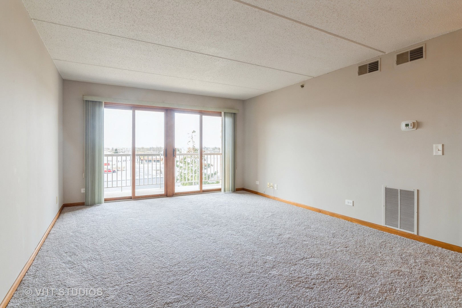 7450 North Waukegan Road, Unit 405 Niles, IL 60714 - Photo 3 of 15 a view of an empty room with a window