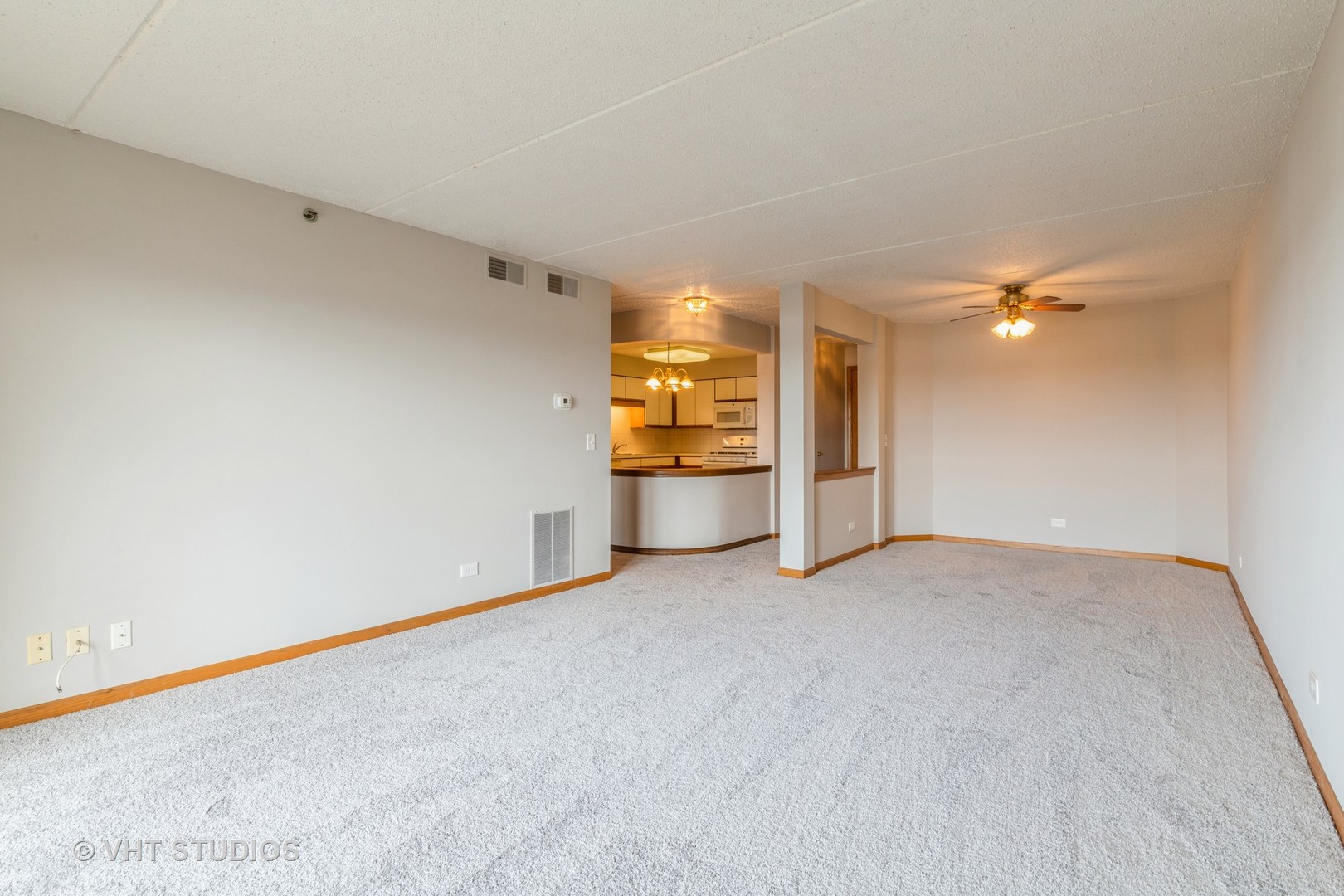 7450 North Waukegan Road, Unit 405 Niles, IL 60714 - Photo 4 of 15 a view of an empty room with a window