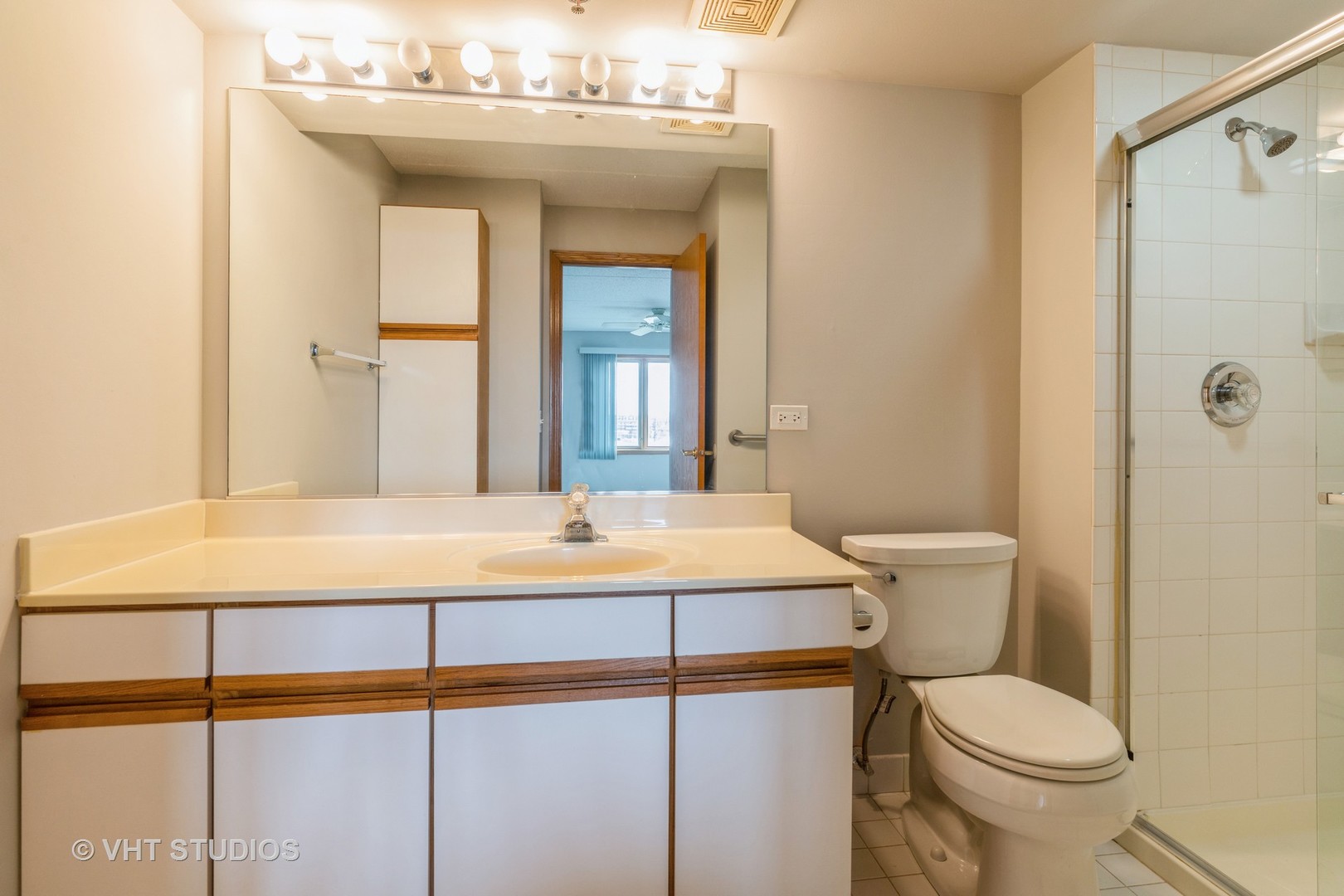 7450 North Waukegan Road, Unit 405 Niles, IL 60714 - Photo 9 of 15 a bathroom with a sink toilet and shower