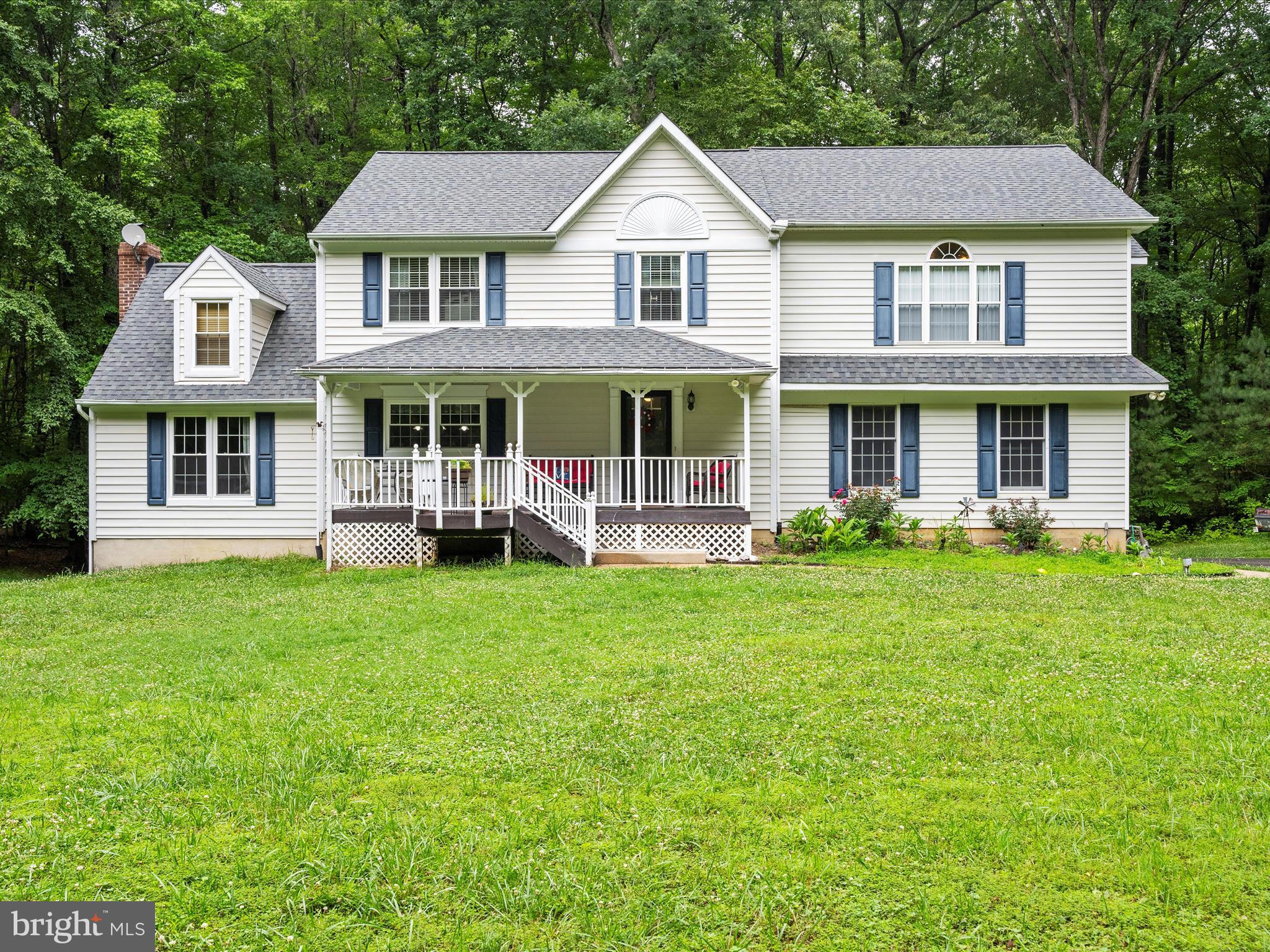 249 Double Oak Road Prince Frederick, MD 20678 - Photo 1 of 30 a front view of a house with a yard and trees