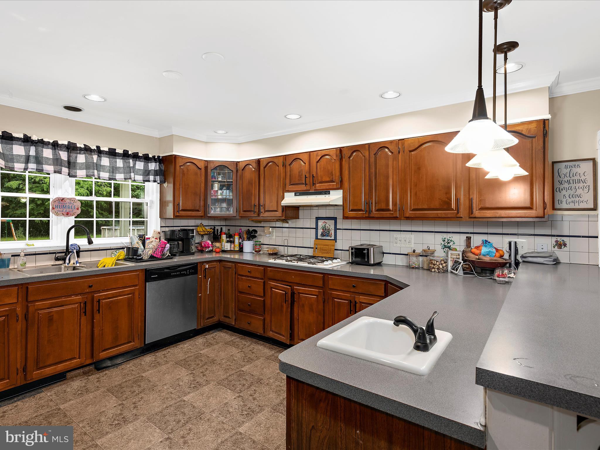 249 Double Oak Road Prince Frederick, MD 20678 - Photo 6 of 30 a kitchen with sink cabinets and appliances