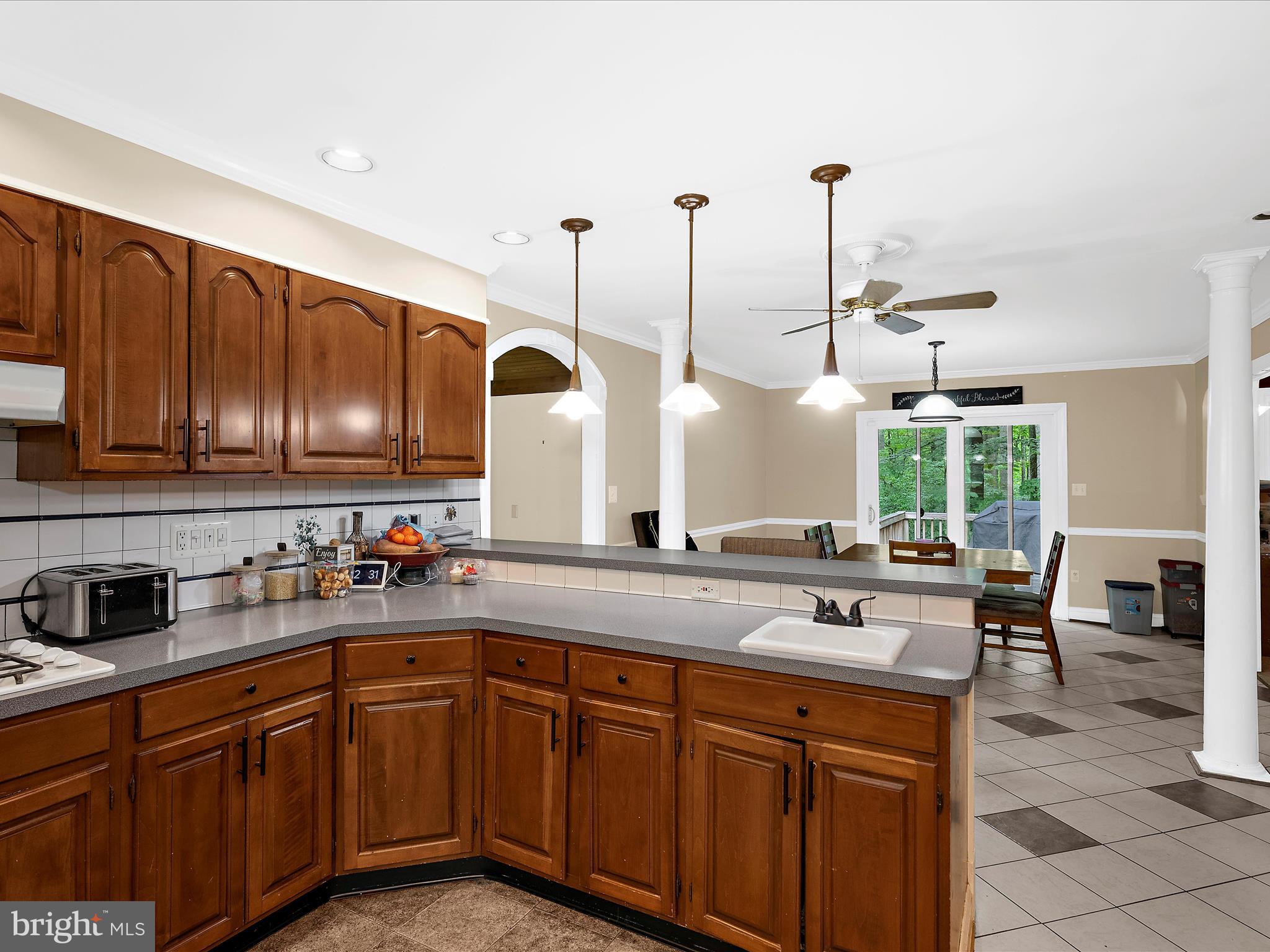 249 Double Oak Road Prince Frederick, MD 20678 - Photo 7 of 30 a kitchen with stainless steel appliances granite countertop a sink a stove and a wooden floors