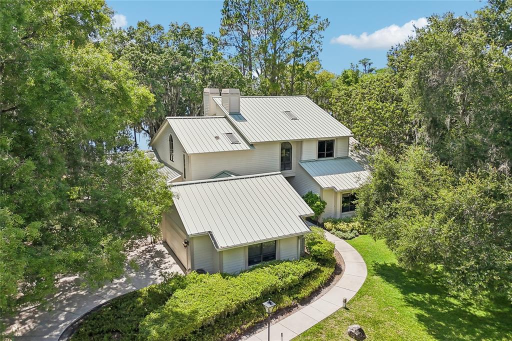 17810 Crawley Road Odessa, FL 33556 - Photo 69 of 76 an aerial view of a house with a yard and trees all around