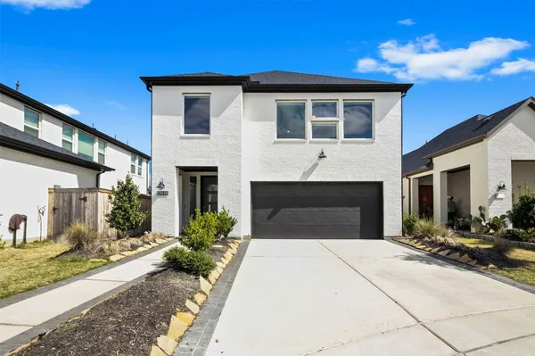a front view of a house with yard