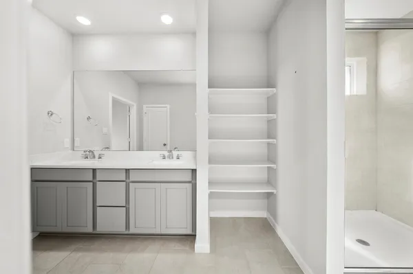a view of a livingroom with a ceiling fan and window
