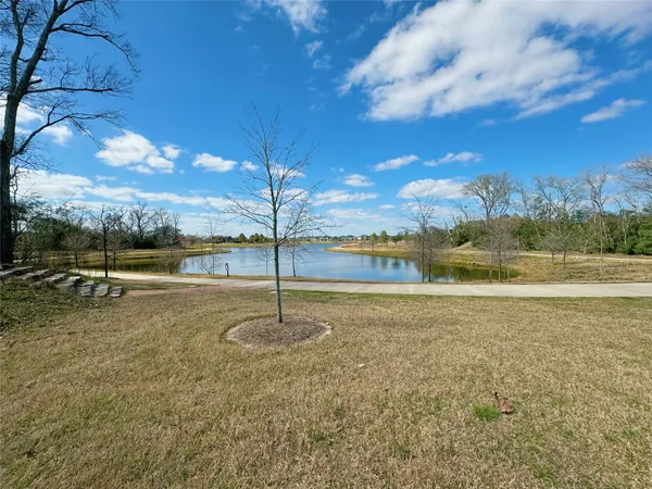 a view of a playground with yard