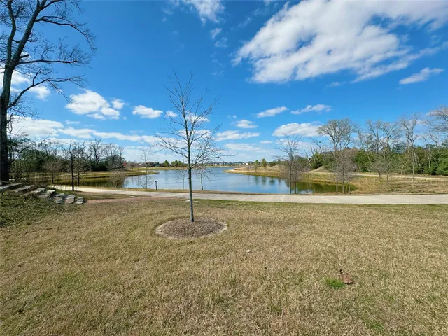 a view of a playground with yard