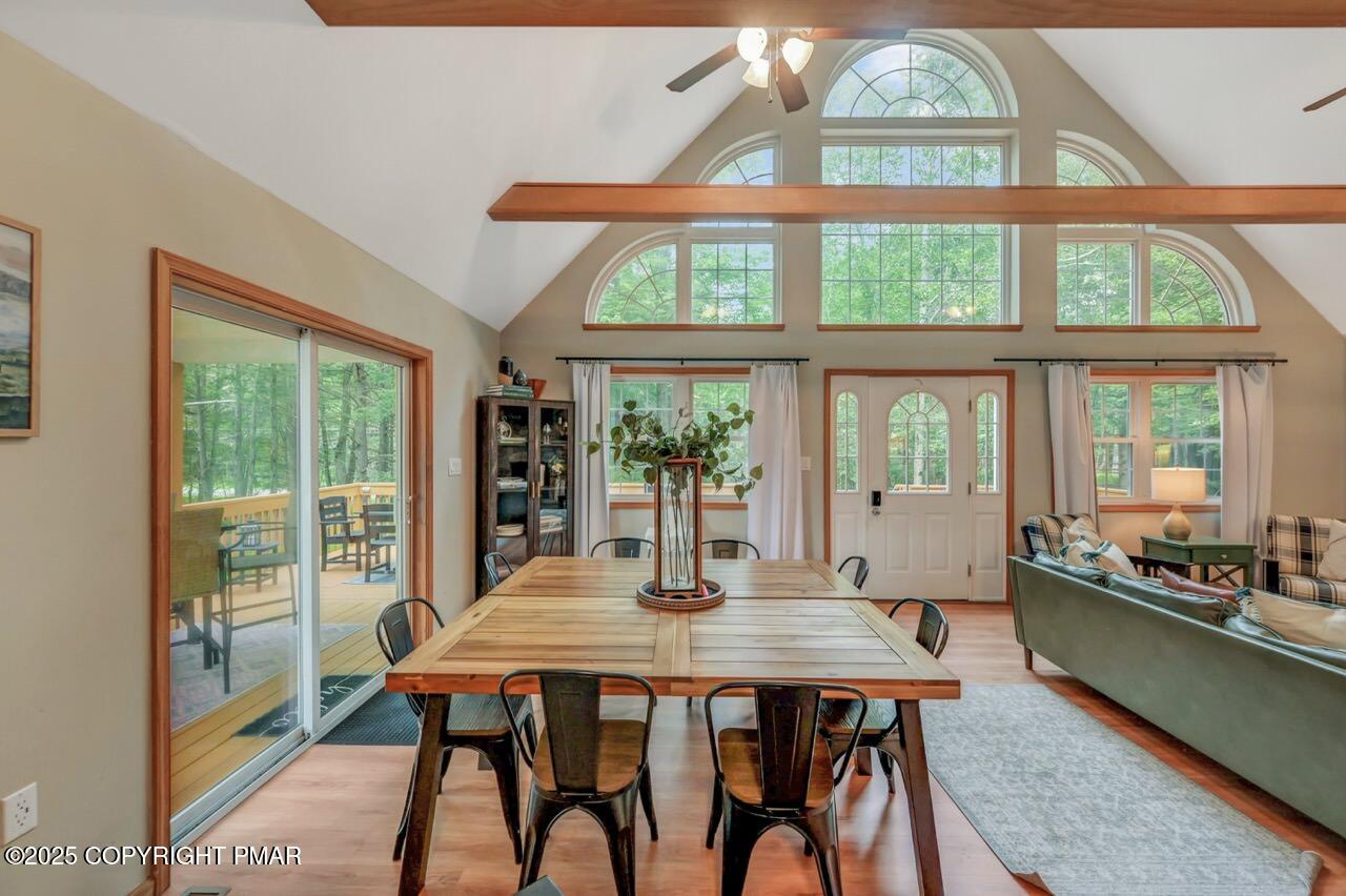 238 King Arthur Road Pocono Lake, PA 18347 - Photo 19 of 95 a dining room with furniture window and wooden floor