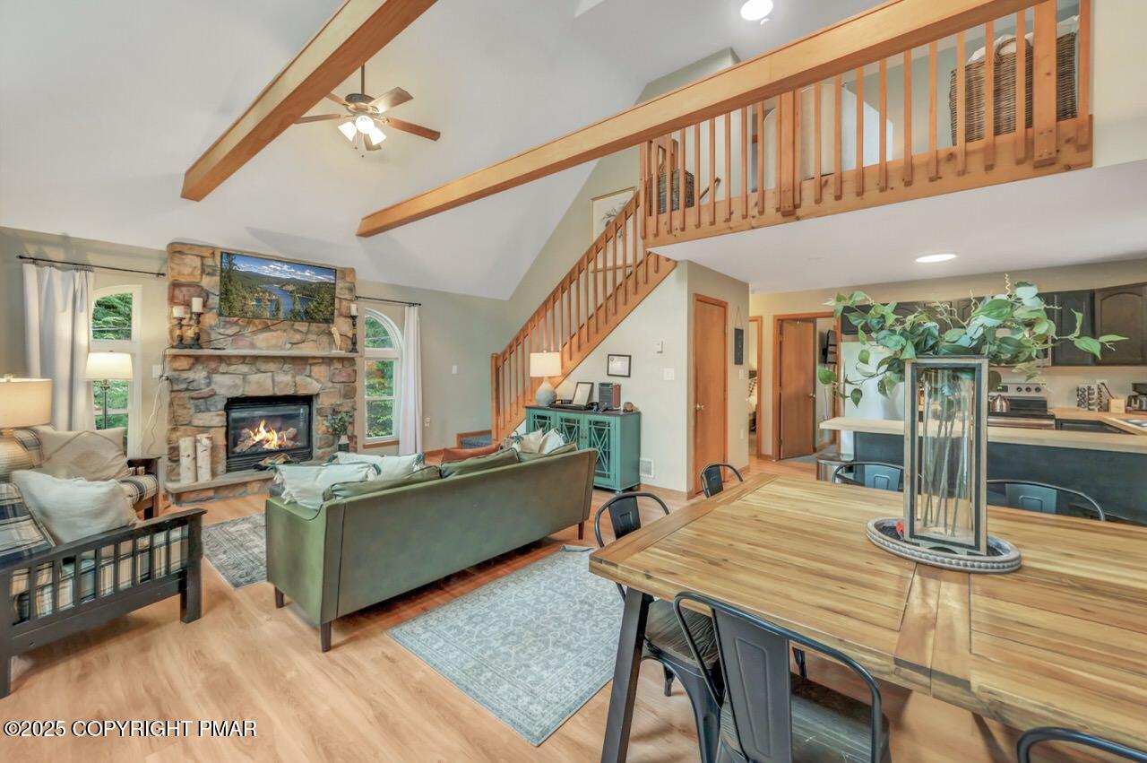 238 King Arthur Road Pocono Lake, PA 18347 - Photo 20 of 95 a living room with furniture a fireplace and a table