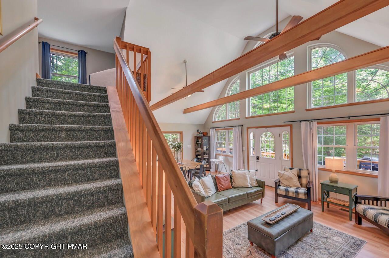 238 King Arthur Road Pocono Lake, PA 18347 - Photo 44 of 95 a living room with furniture and stairs
