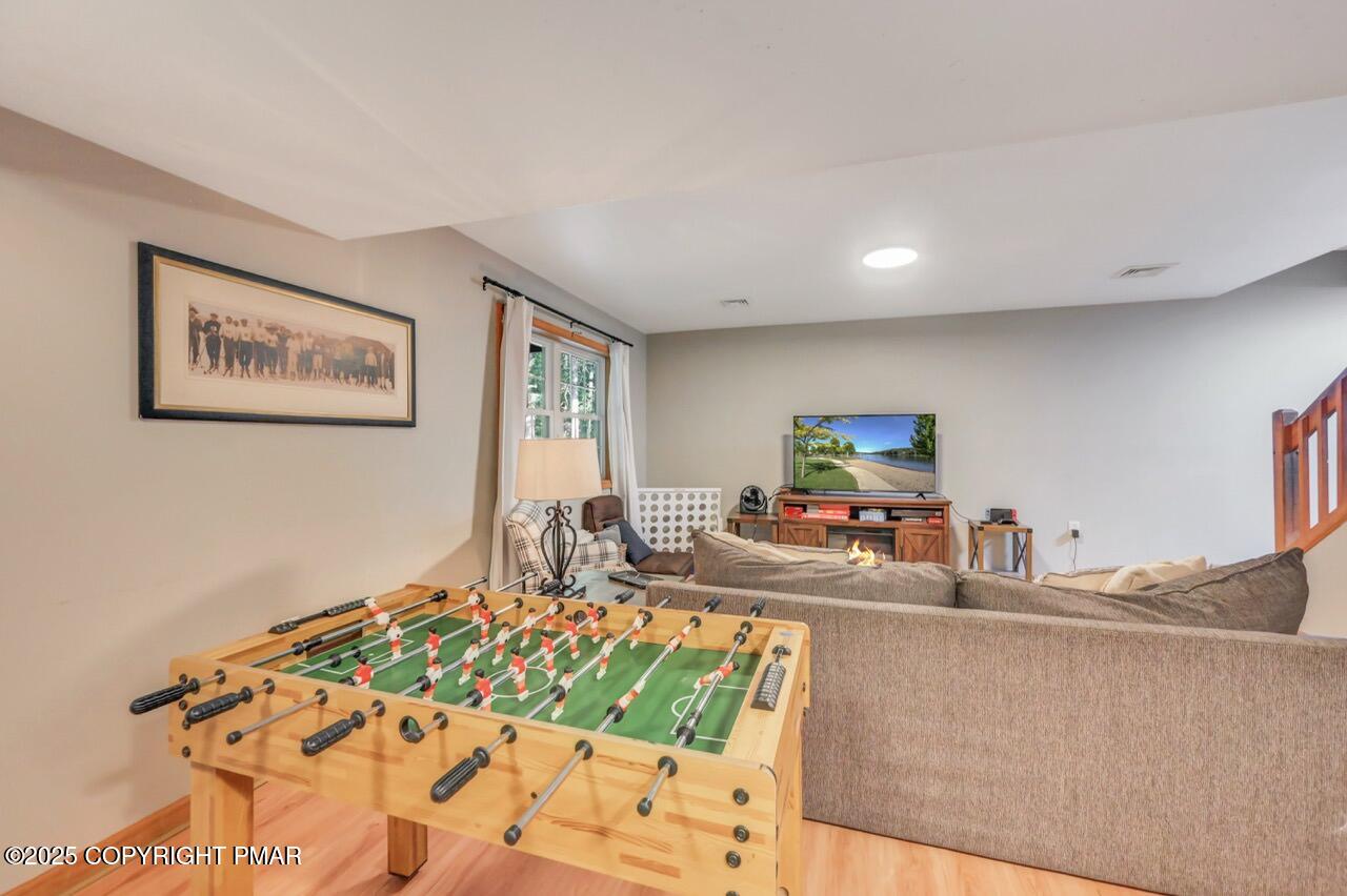 238 King Arthur Road Pocono Lake, PA 18347 - Photo 64 of 95 a living room with furniture and a flat screen tv