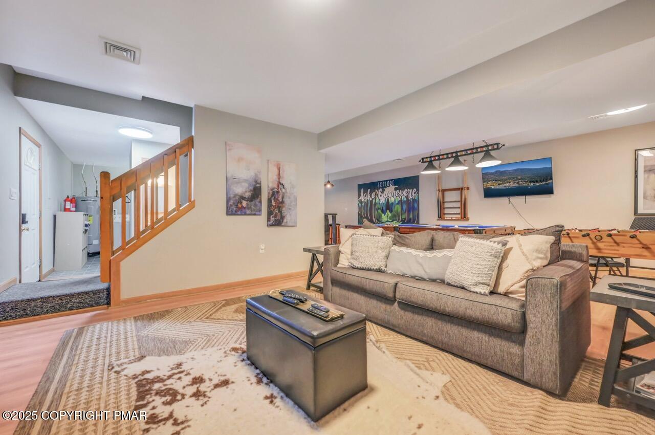 238 King Arthur Road Pocono Lake, PA 18347 - Photo 69 of 95 a living room with furniture and a wooden floor