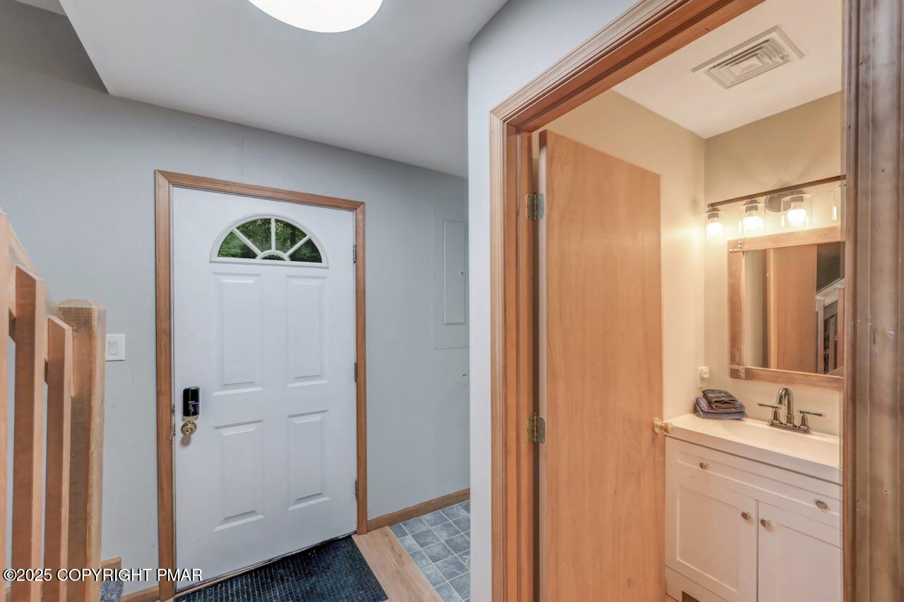 238 King Arthur Road Pocono Lake, PA 18347 - Photo 70 of 95 a bathroom with a shower sink and mirror