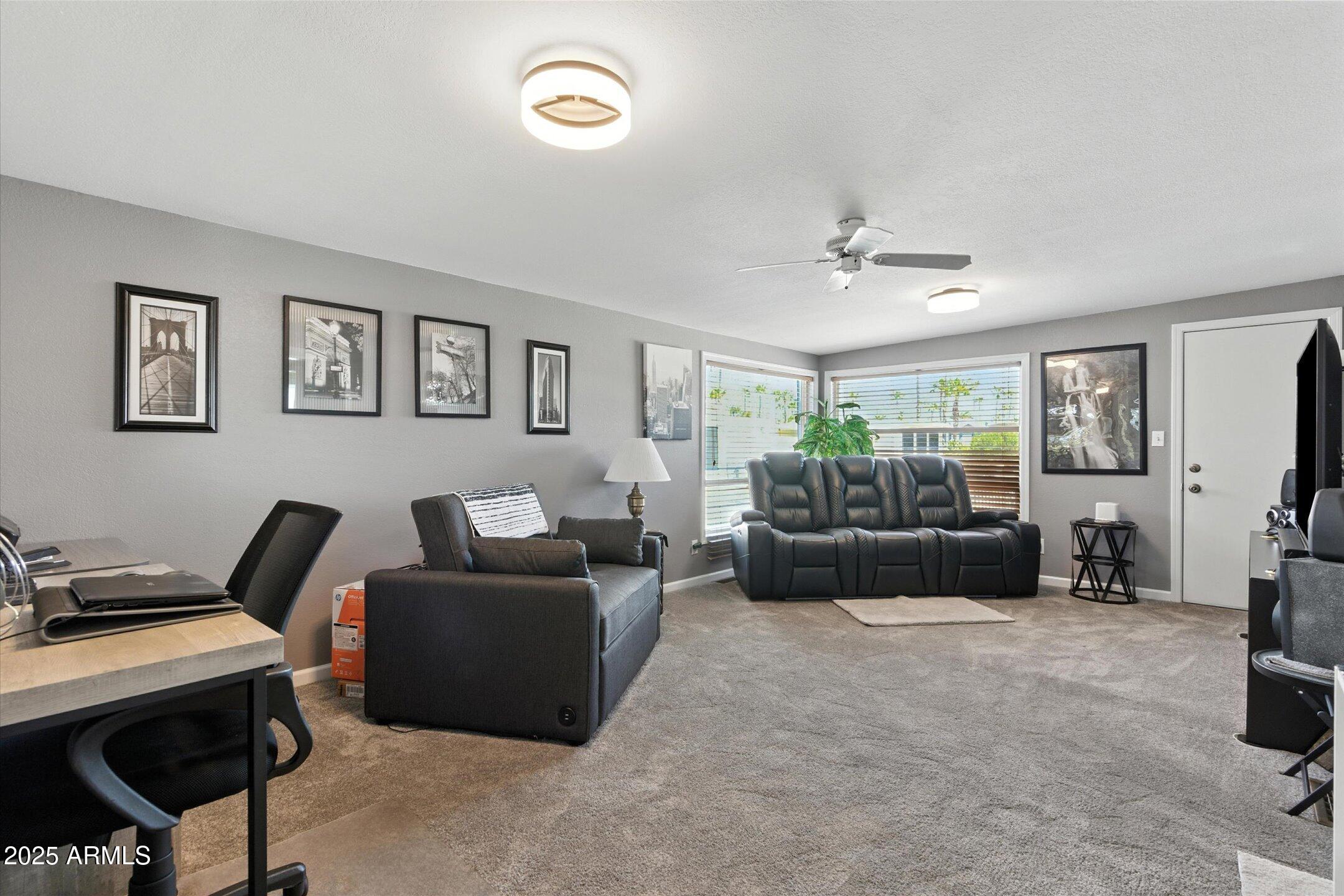2366 East Pima Avenue Apache Junction, AZ 85119 - Photo 10 of 22 a living room with furniture and a window