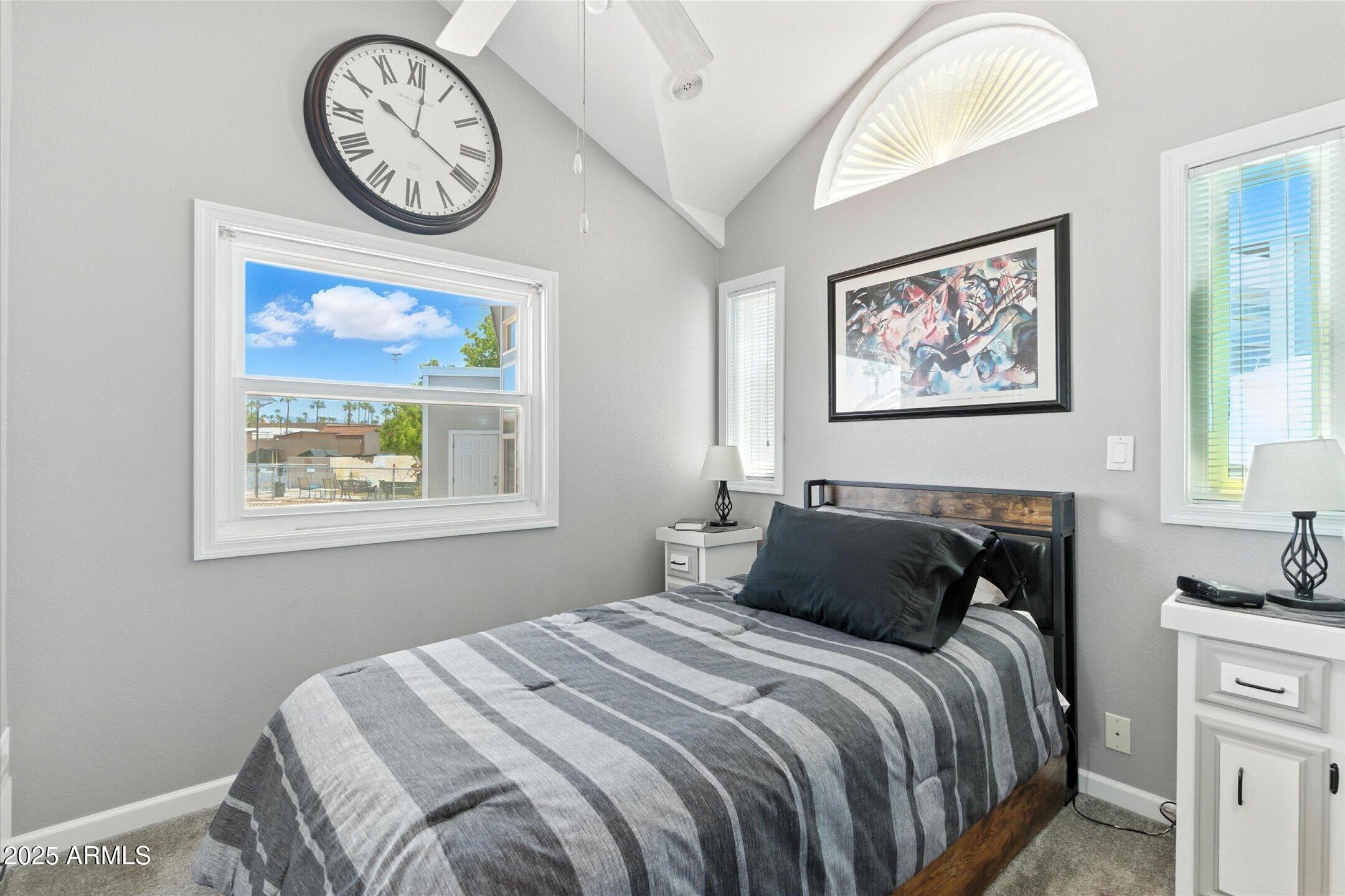 2366 East Pima Avenue Apache Junction, AZ 85119 - Photo 14 of 22 a bedroom with a bed and a wall painting