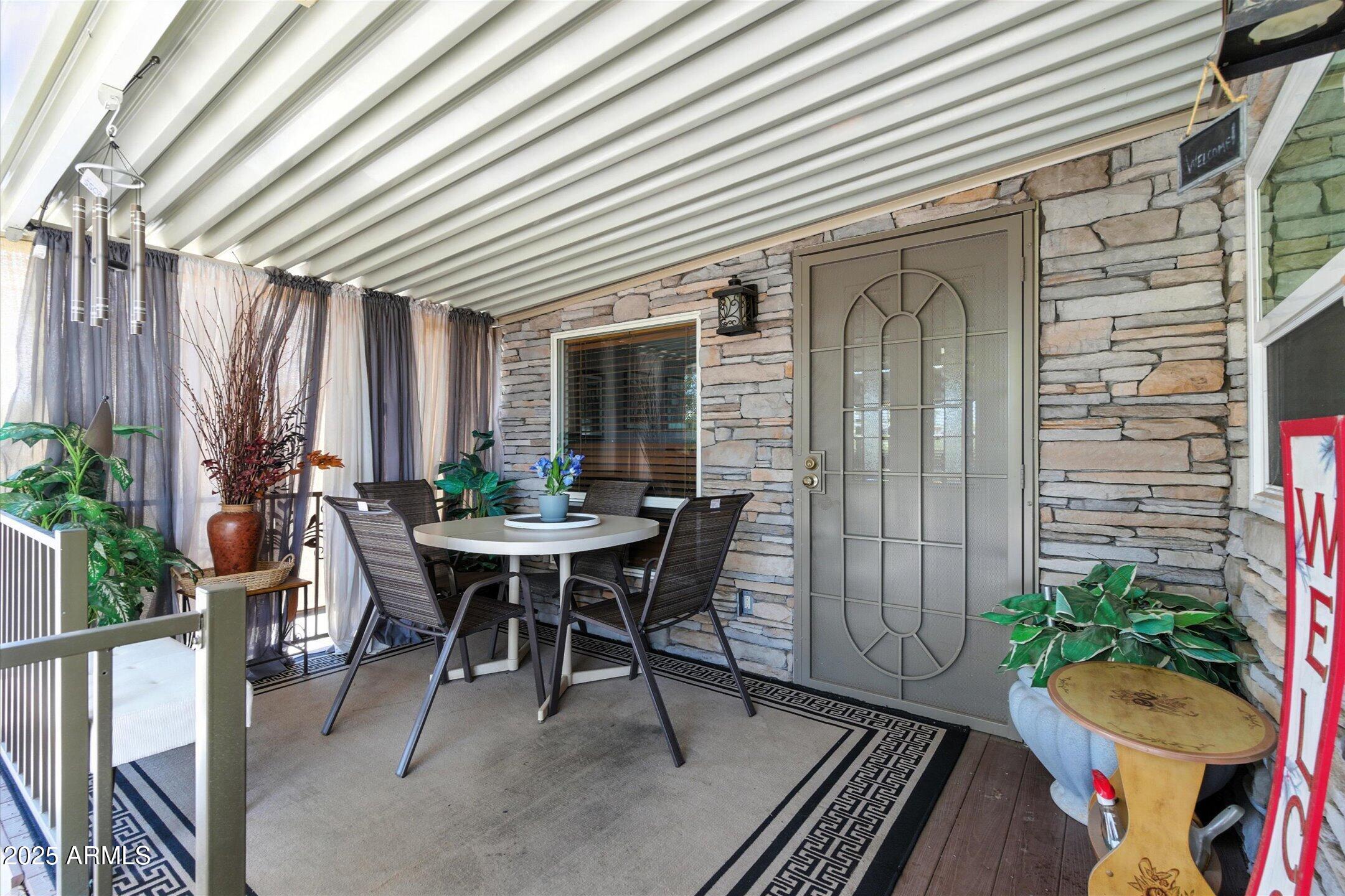 2366 East Pima Avenue Apache Junction, AZ 85119 - Photo 19 of 22 a view of a dining room with furniture and potted plant