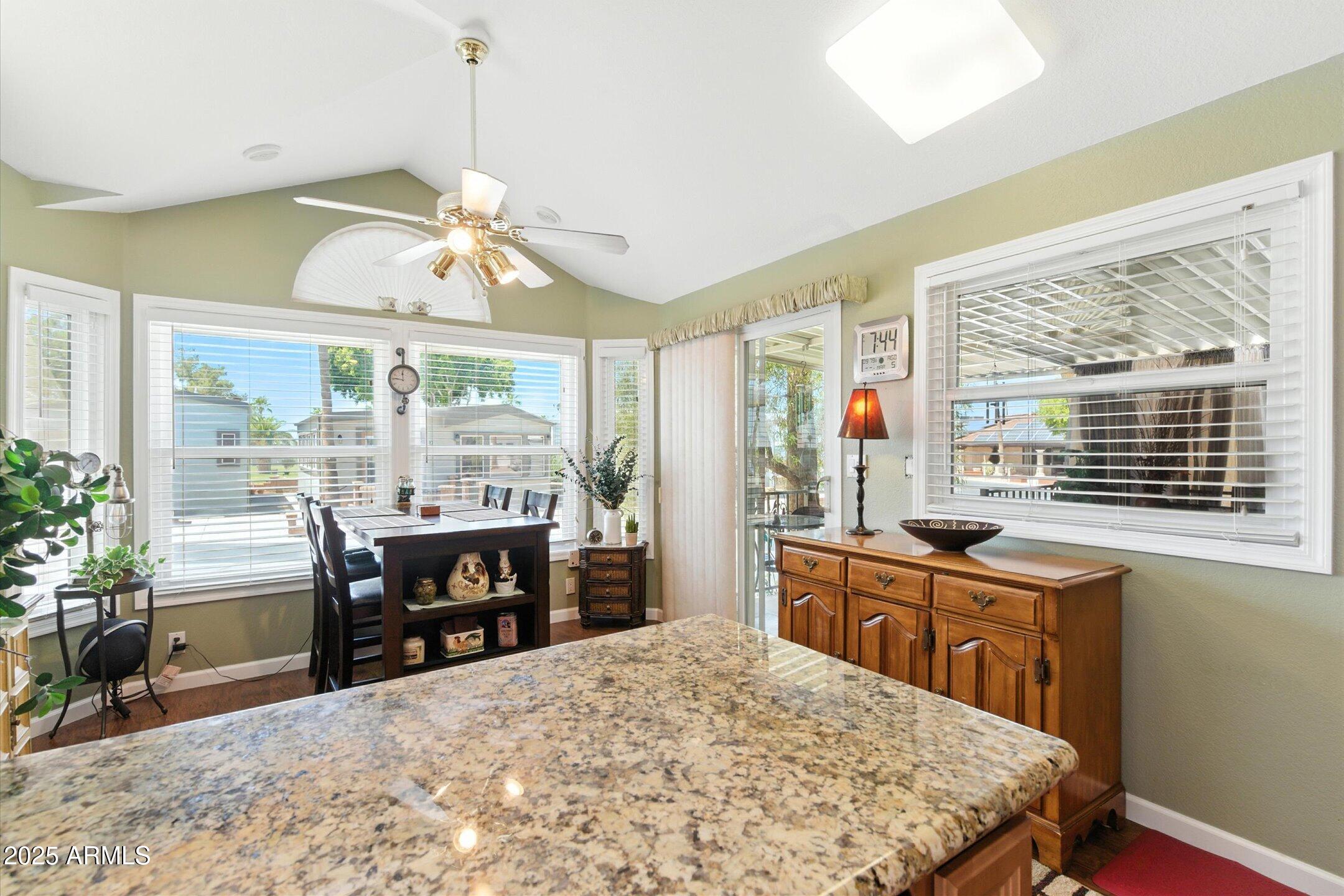 2366 East Pima Avenue Apache Junction, AZ 85119 - Photo 4 of 22 a view of a dining room with furniture window and outside view