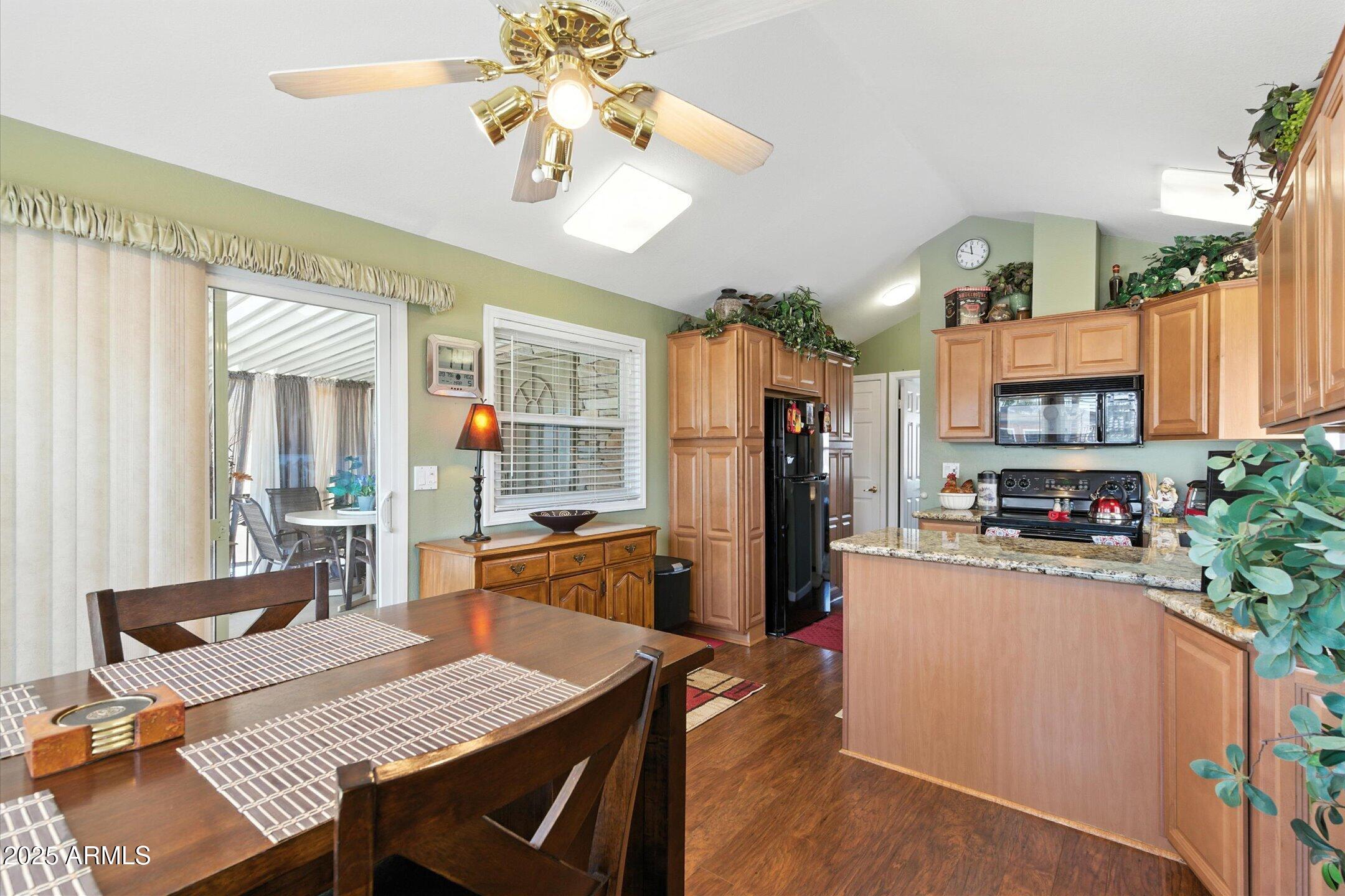 2366 East Pima Avenue Apache Junction, AZ 85119 - Photo 7 of 22 a view of a dining room with furniture and chandelier