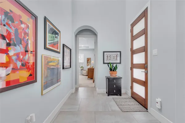 a view of living room filled with furniture and baby crib