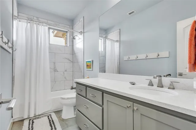 an aerial view of a house with a garden