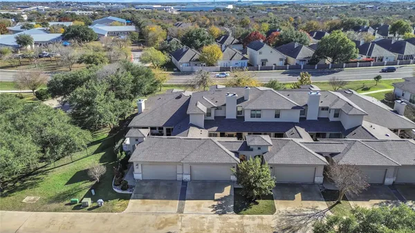 an aerial view of a house with a swimming pool