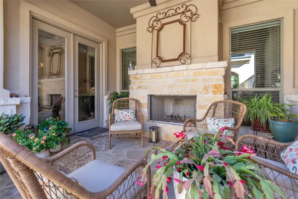 a front view of a house with outdoor seating