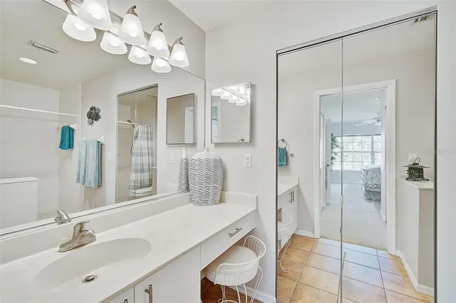 a bathroom with a sink a mirror and a shower