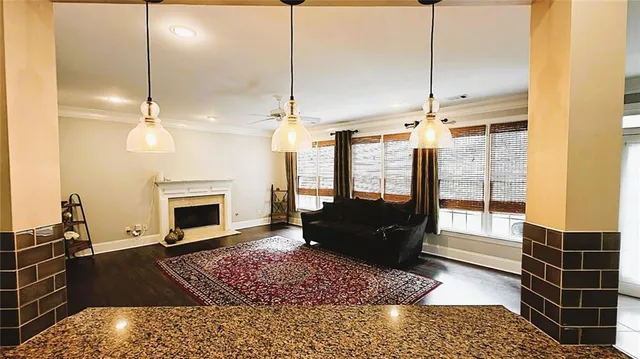 a large kitchen with kitchen island granite countertop a large counter top appliances and cabinets