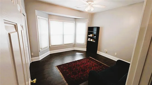 a view of an entryway with wooden floor