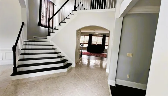 a view of entryway and hall with a front door