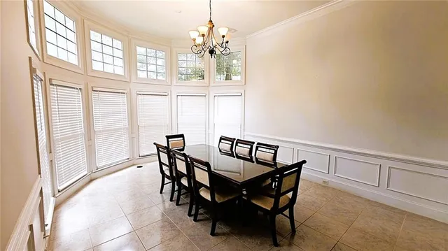 a view of a livingroom with furniture window and wooden floor