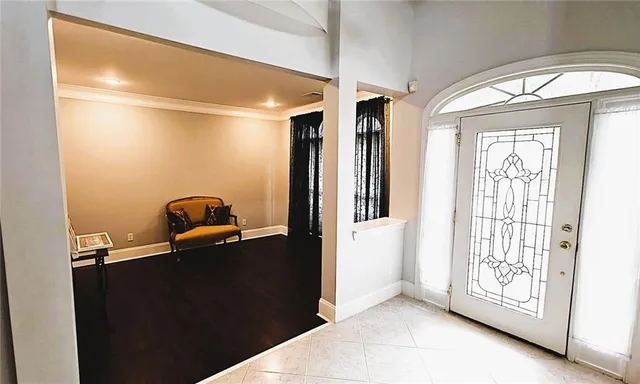 a view of entryway and hall with wooden floor
